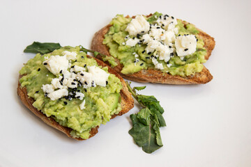 Avocado toast. Sliced bread with avocado.