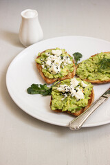 Avocado toast. Sliced bread with avocado.