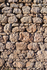 Stone wall texture background - grey stone siding with different sized stones