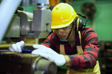 Skill technician worker on manual lathe machine
