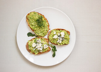 Avocado toast. Sliced bread with avocado.