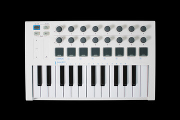 White midi keyboard with knobs and pads