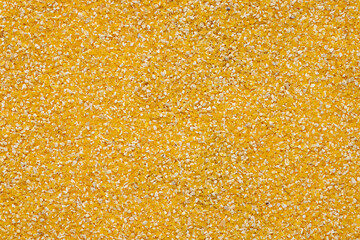 Closeup corn groats seed background, texture.