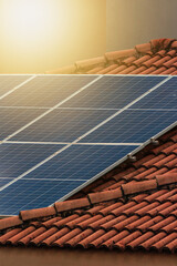 Solar photovotaic panel at a roof at suset.  Solar energy house company concept image. Space for...