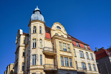 Obraz premium Facade with tower and balconies of historic tenement houses