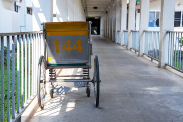 Fototapeta na wymiar Empty wheelchair parked in hospital walk way or corridor.
