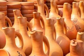 Fototapeta na wymiar Traditional Georgian clay pottery for sale in the village of Shrosha