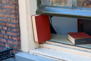 Re use an old book to keep the window open close up
