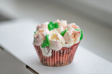 Homemade organic cupcake with butter cream, close-up.