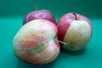 Close up of beautiful apples with a turquoise background