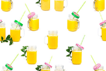 Fototapeta premium Seamless Pattern Orange juice and green leaves isolated on a white background.A glass of orange juice. Healthy food. Vegan food