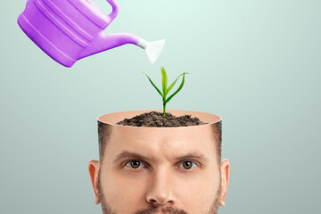 A fresh idea, a man's head is open hand watering the plant growing from the head. Creative background, brain, fantasy, creativity.