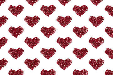 Pattern with garnet seeds on white background