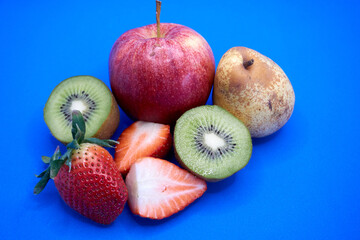 Close up of apple, pear, kiwi and strawberries
