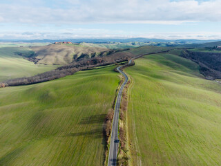 road in the hills seen from the drone in spring
