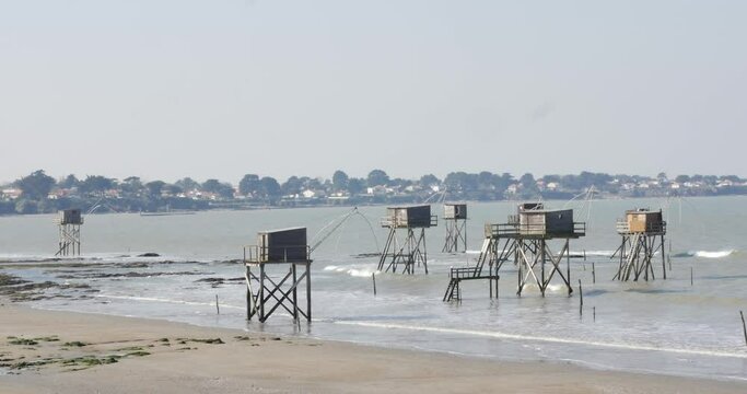 House of fishermen on stilts. Holiday in France Concept. Fishing wooden cabin carrelet. fishing hut on stilts called Carrelet. Typical old wooden fishing huts on stilts in the atlantic ocean. typical 