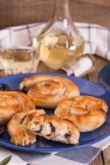 Pastry swirls with cheese and olive filling.