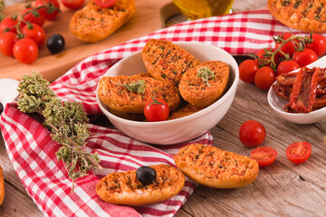 Toasted bread with tomato and oregano. 