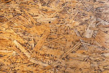 Brown and yellow wooden background. Old wood, light and shadow, copy space.