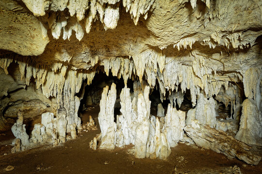 Kiwengwa Caves on Zanzibar island in Tanzania, worship locals ancestors, gifts to the holy stones, stalagmites and stalactites formed by water dissolving coral stones