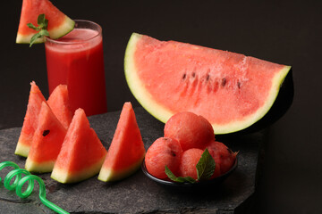 Watermelon smoothies or juice topping with fresh watermelon and mint leaves for summer drinks concept.