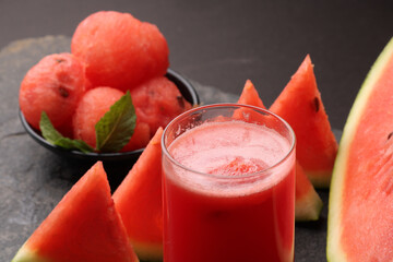 Watermelon smoothies or juice topping with fresh watermelon and mint leaves for summer drinks concept.