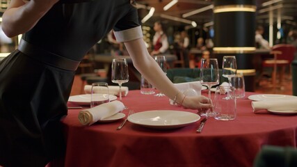 Fototapeta na wymiar Waiter serving food in restaurant