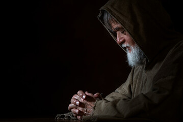 A medieval monk in prayer