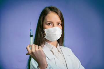 Nurse or female doctor holding an injection needle