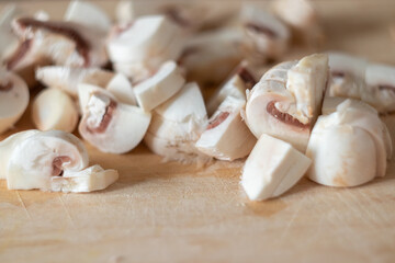 sliced mushrooms on a chopping wooden board close-up