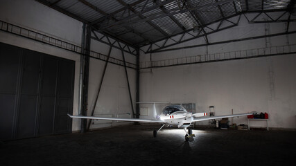 small private jet in hangar