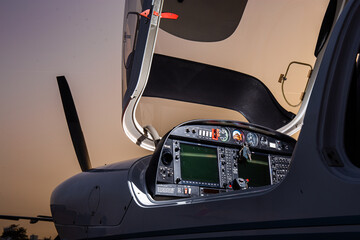 open small private jet in sunset control panel