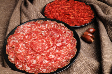 Servings of chorizo and 100% acorn-fed Iberian salchichón from Extremadura decorated with acorns