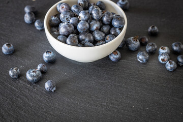 Fresh blueberries on a stone countertop.