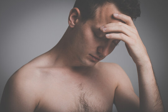 Depressed young man going through a rough patch in his life - suffering from mental exhaustion, anxiety, burnout, depression (colour toned image)