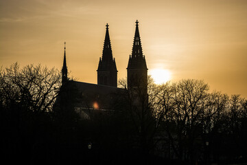 Prague, Czech republic - February 24, 2021. Silhouette of Basilica Minor in Vysehrad fortress area in sunset