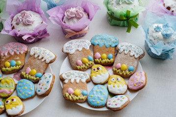 Beautiful Easter cakes on a decorated light table. A light holiday of Easter.