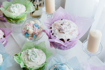 Beautiful Easter cakes on a decorated light table. A light holiday of Easter.