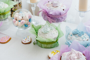 Beautiful Easter cakes on a decorated light table. A light holiday of Easter.