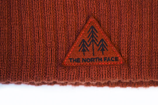Moscow, Russia - March, 2021: The North Face logo symbol emblem on cap for sale in shop.The North Face is an American outdoor product company specializing in outerwear