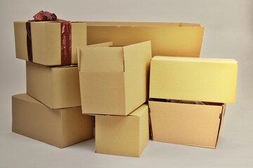 A lot of cardboard boxes brought from a warehouse, close up on a white background