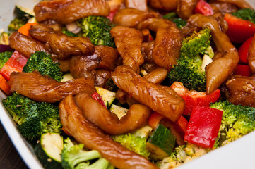 Fried chicken stripes with vegetables dish