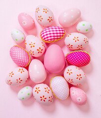 Fototapeta na wymiar Happy Easter. Pink pastel color eggs variety on pink background