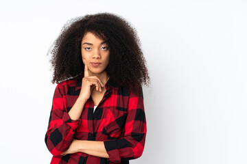 Young african american woman over isolated background and thinking