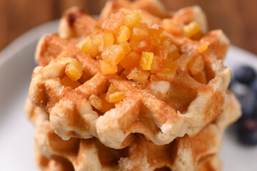 Appetizing waffles with jam for dessert.