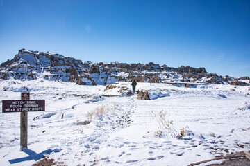 Tourists in Badlands National Park in winter, South Dakota, U. S. A.