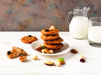  slide of cookies with nuts and  a glass of milk