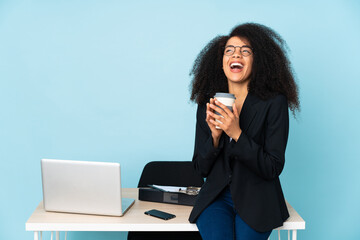 African american business woman working in her workplace scheming something