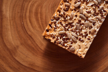 Flour breadcrumbs biscuits with sunflower flax seeds on awooden background. Top view.