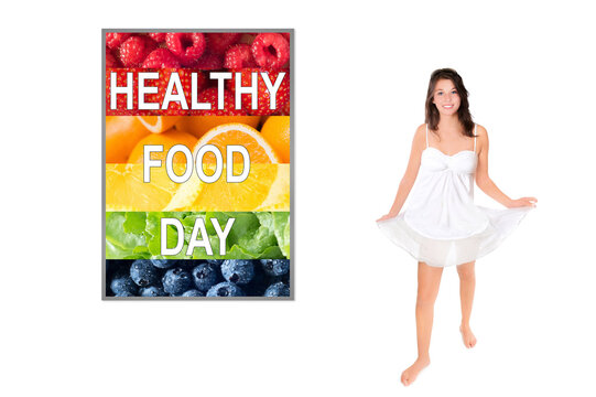 Dancing girl in front of a photo with colorful fruits and vegetables, healthy food day is written on the framed image, isolated on white background